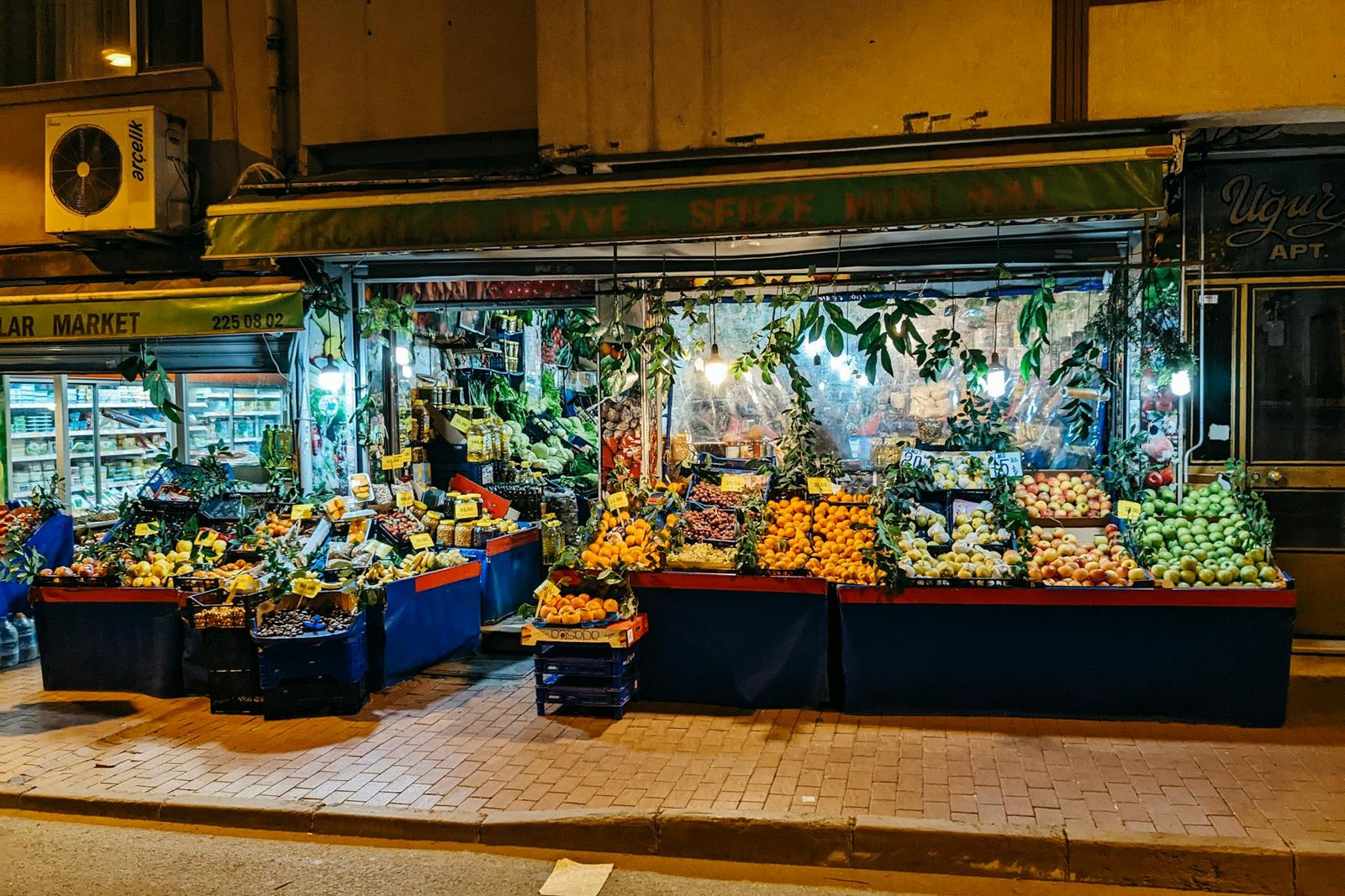 illuminated market stall with fresh fruit and vegetables