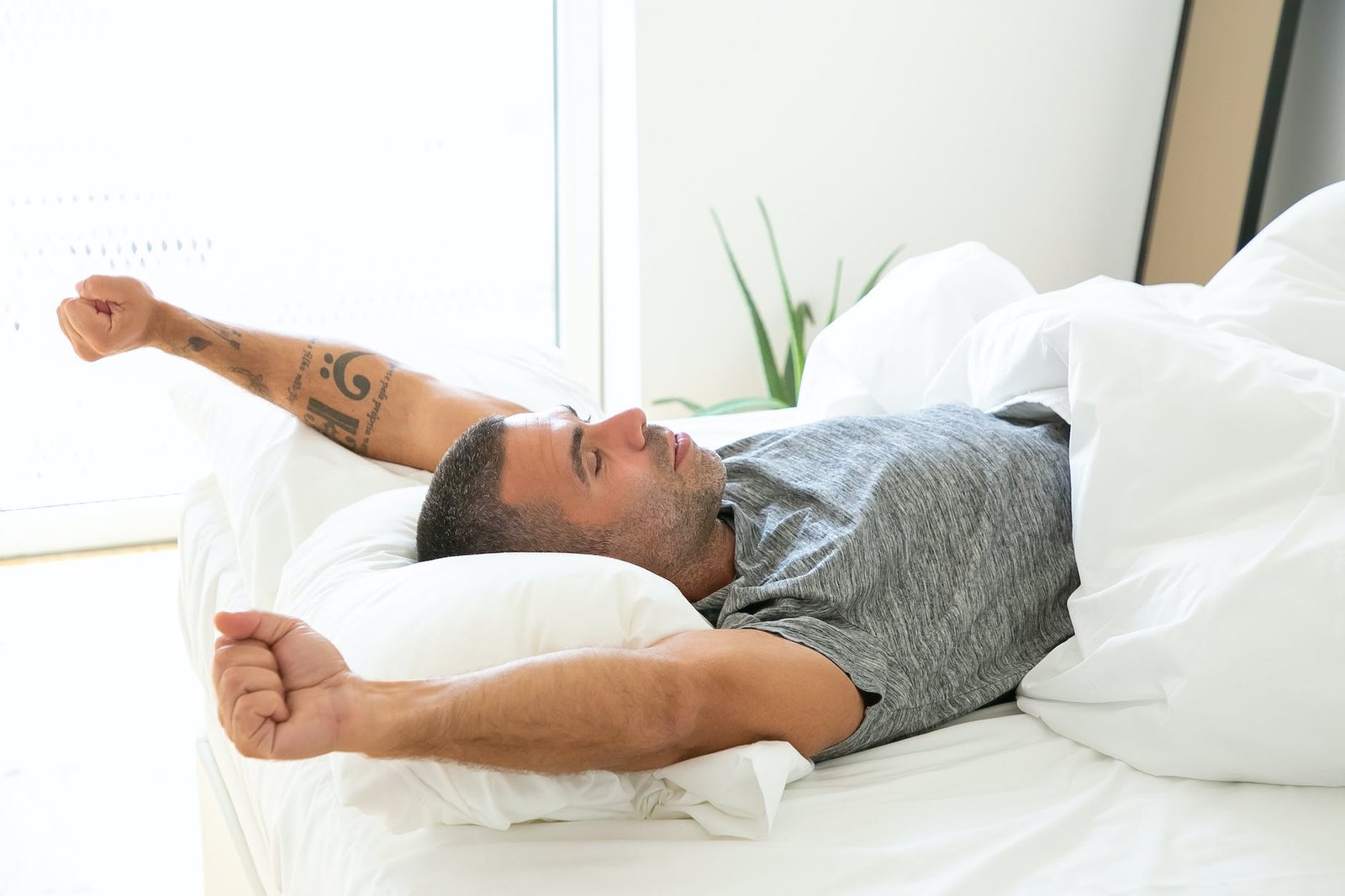 man in gray shirt waking up