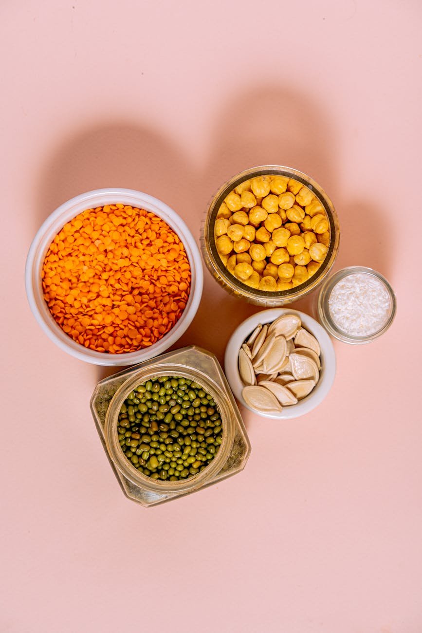 containers with chickpeas beans and lentil seeds